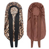 A satin sleep bonnet in brown and black leopard print fabric is shown folded.