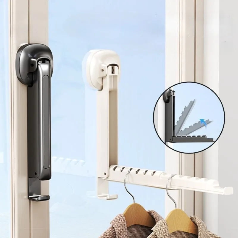 A white foldable wall drying rack with suction cups is shown mounted on a window frame.