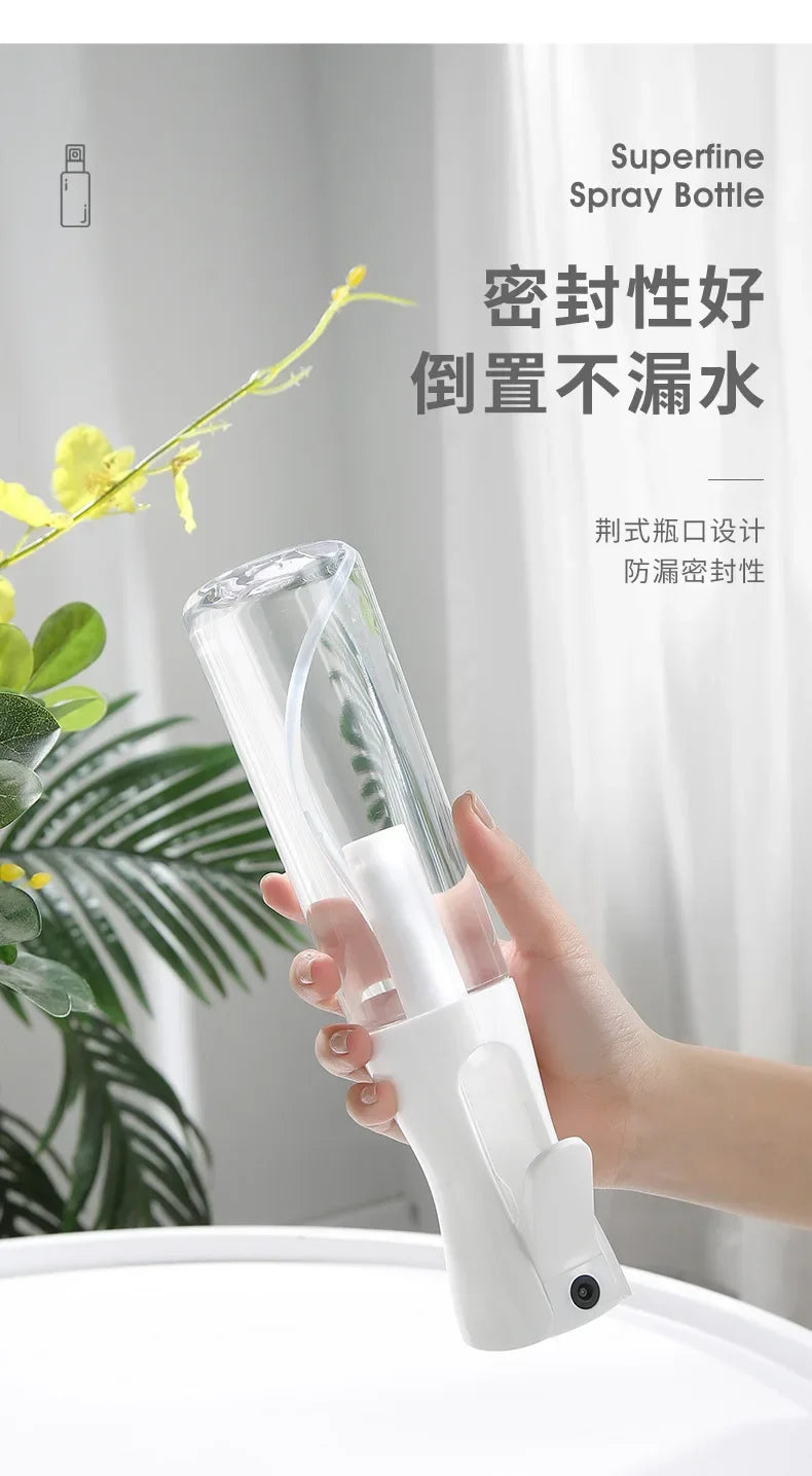 A hand holds a clear, white mist spray bottle designed for hair and beauty, demonstrating its fine mist capability.