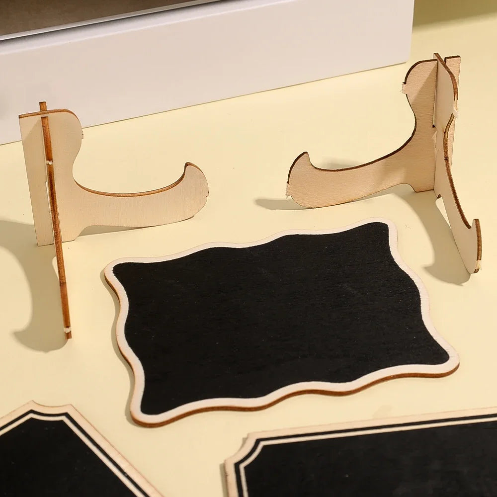 A set of mini wooden chalkboard signs and mounting pieces for crafting or display.