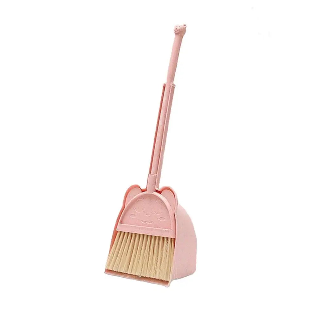 A pink toddler mini broom and dustpan set with a handle and brush.