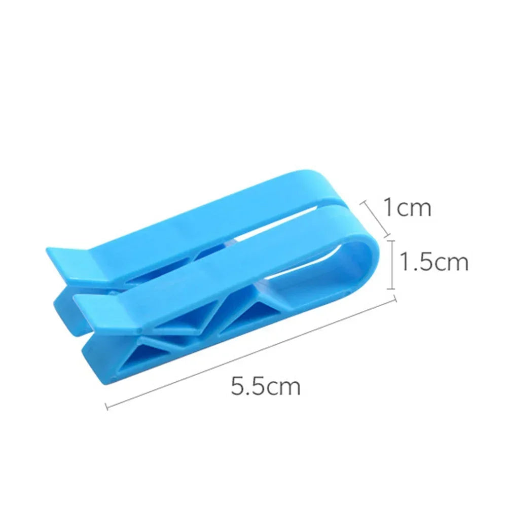 A blue reusable silicone bag clip with dimensions 1cm thick and 5.5cm long.