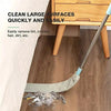 A telescopic long handle microfiber duster is cleaning dust and debris from a wooden surface.
