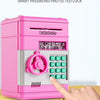 A pink electronic password-protected lock box with a numeric keypad is shown being operated by a hand.