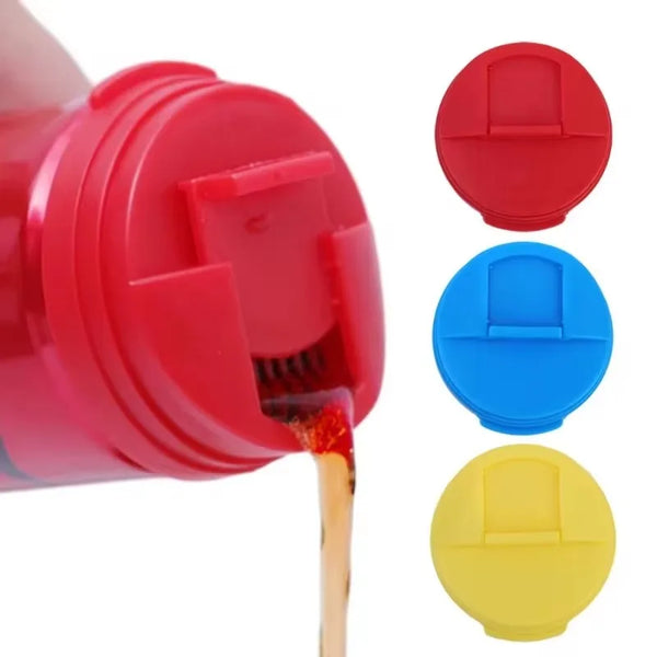 A red plastic beverage can sealer with three colored caps: red, blue, and yellow.
