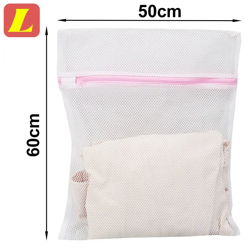 White mesh laundry bag with pink trim, measuring 50cm by 60cm.