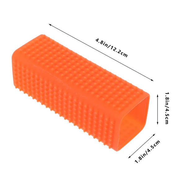 Orange silicone pet hair remover brush with dimensions 4.8in long and 1.8in wide