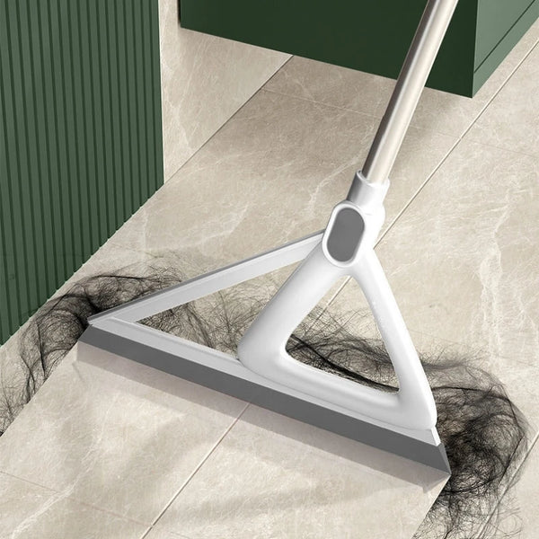A white silicone window and surface cleaner is shown resting on a light-colored floor.