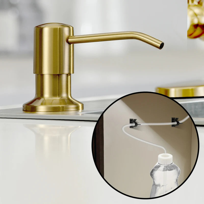 A brass-colored kitchen faucet with an extension tube is shown on a countertop.