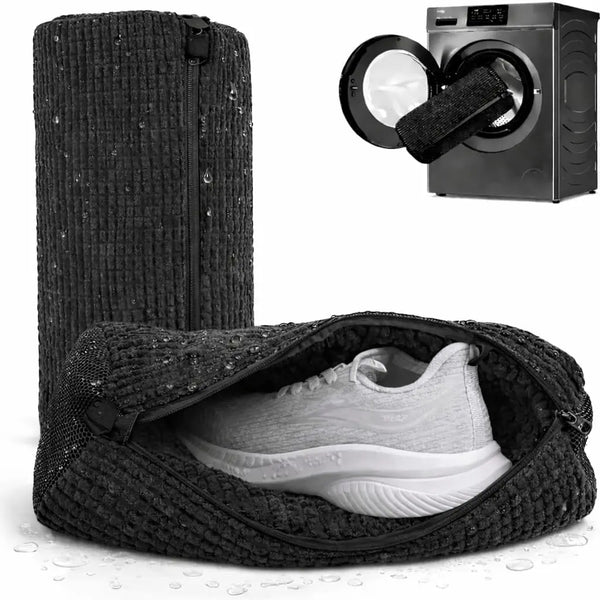 A black reusable shoe laundry bag containing a white athletic shoe, next to a washing machine accessory.