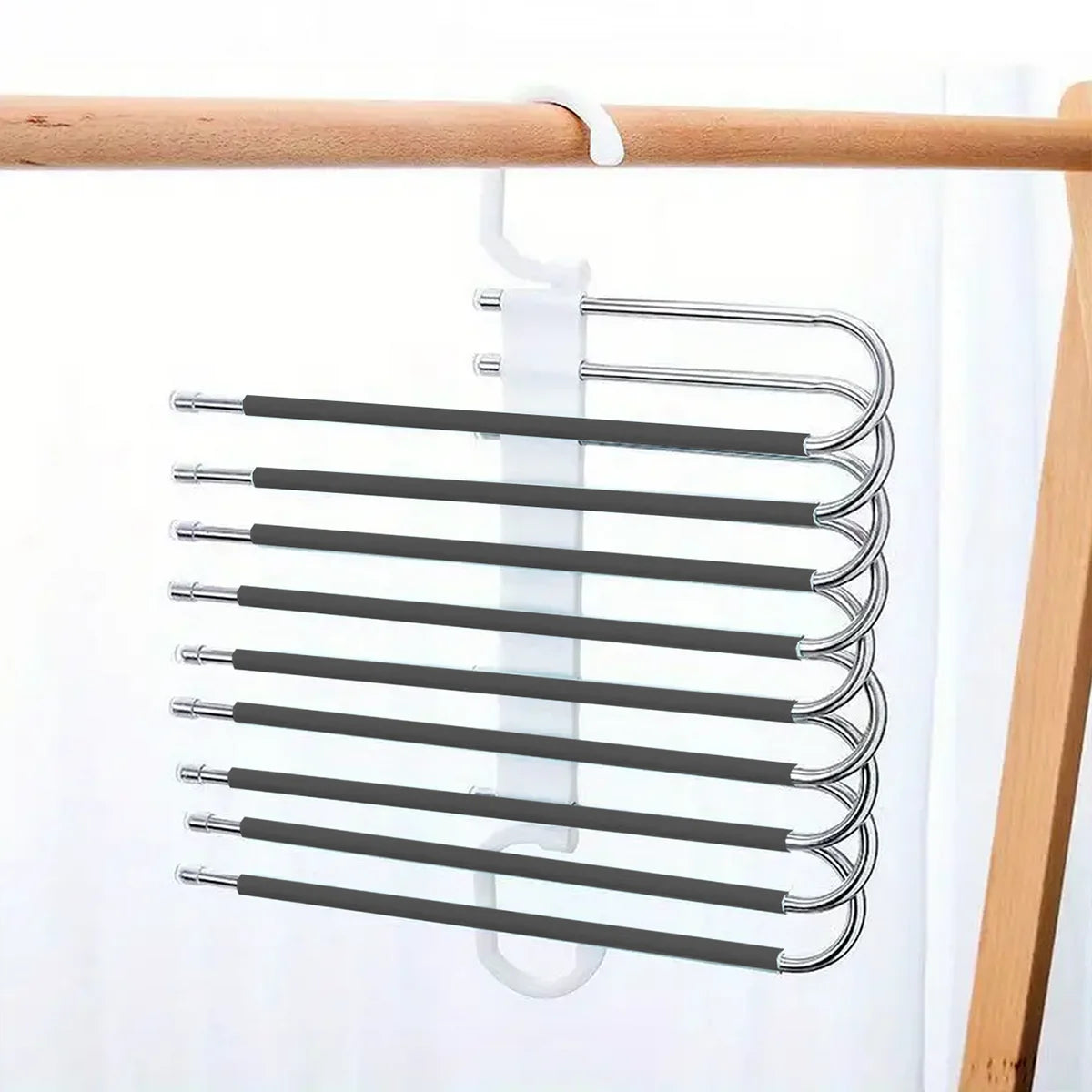Stainless steel multi-layer hangers hanging from a wooden bar