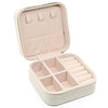 A light pink portable PU leather jewelry storage box with a hinged lid and divided compartments.