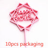 Pink acrylic hexagonal birthday cake topper with the words happy birthday on a stick