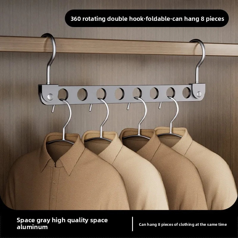 A silver aluminum double hook foldable storage rack with eight hangers hanging on a wooden rod.