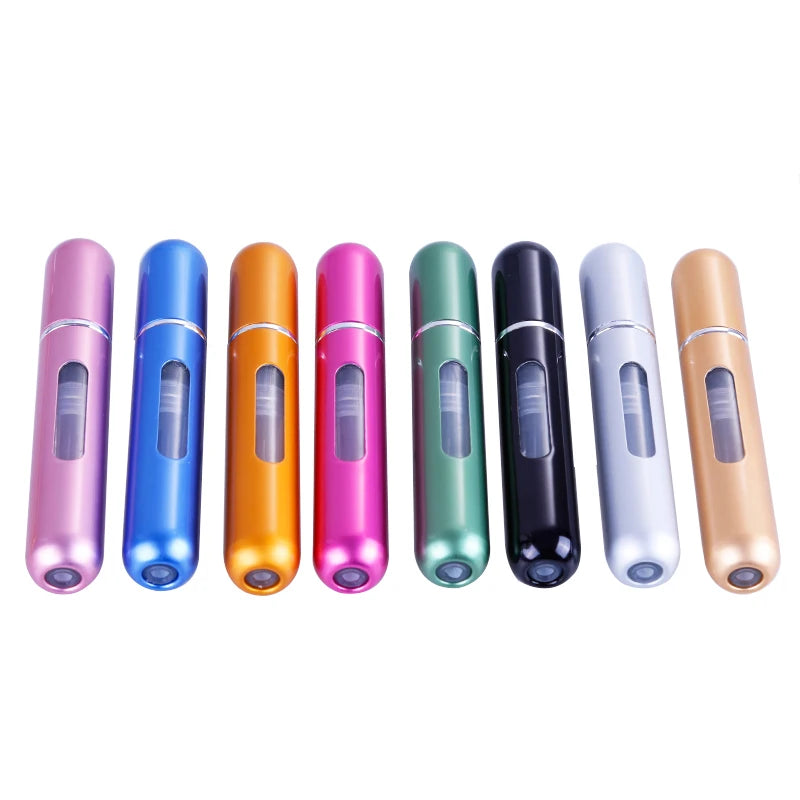 A row of nine portable refillable perfume spray bottles in various colors including pink, blue, orange, magenta, green, black