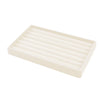 A rectangular velvet jewelry organizer tray with a slotted design.