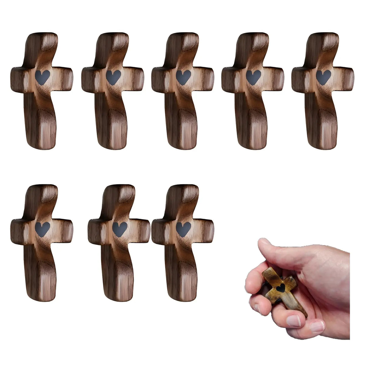 A set of handcrafted wooden pocket crosses with heart engravings shown from multiple angles.
