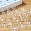 Clear adhesive cable clips for desk and wall organization shown next to a white plastic organizer box.