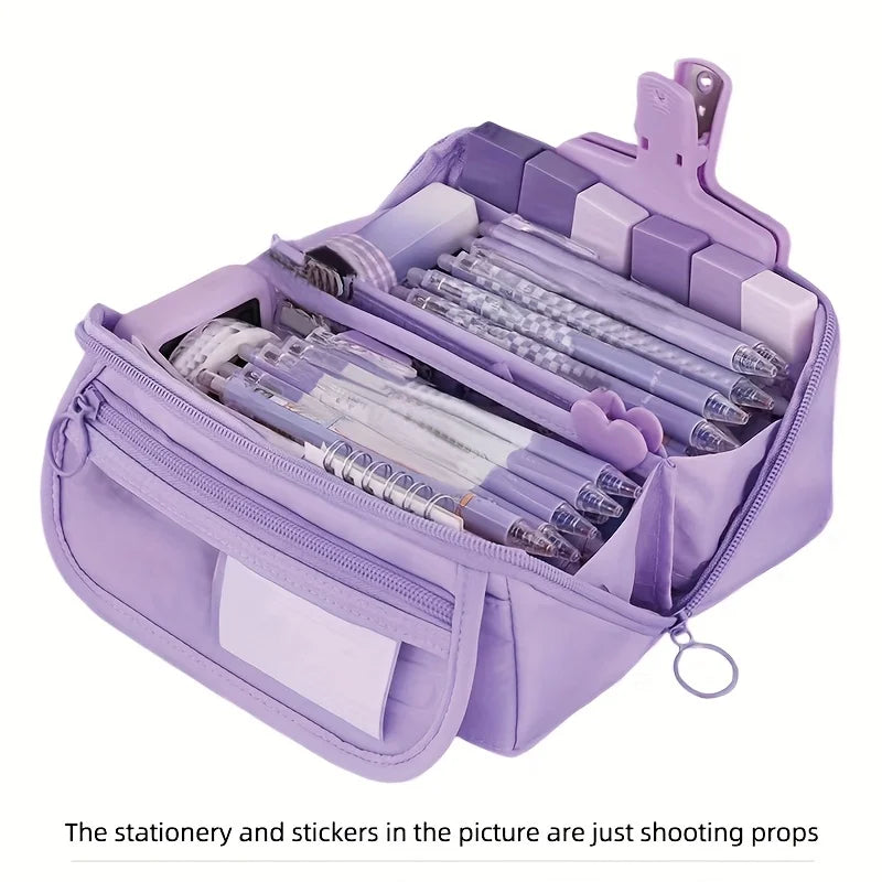 A purple multi-compartment pencil case organizer filled with pens and stickers.