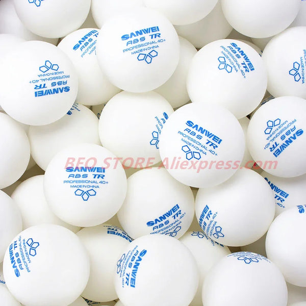 A close-up view of a pack of white Sanwei ABS TR table tennis balls.