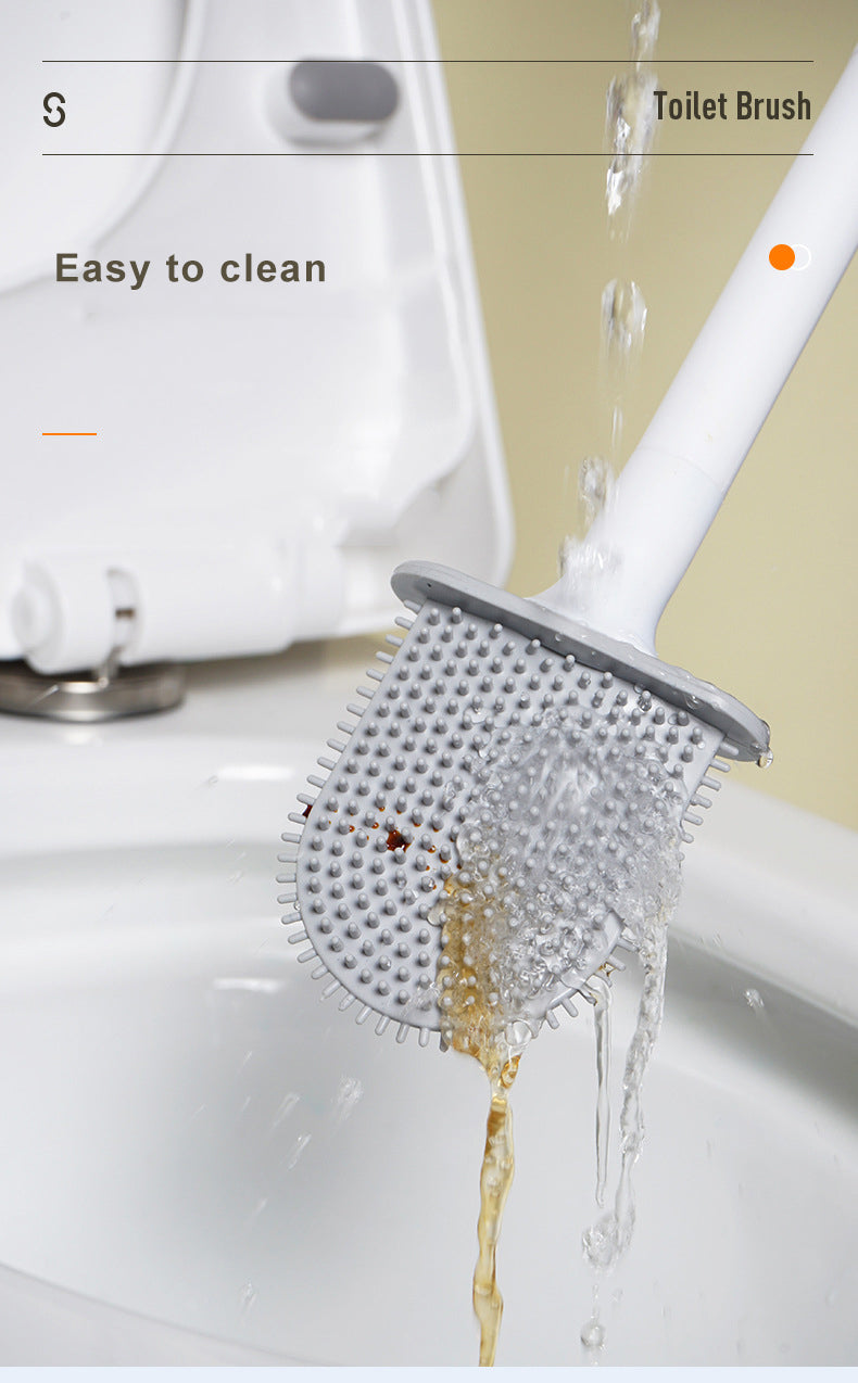 Une brosse à vaisselle en silicone blanche nettoie un évier, démontrant sa facilité de nettoyage.