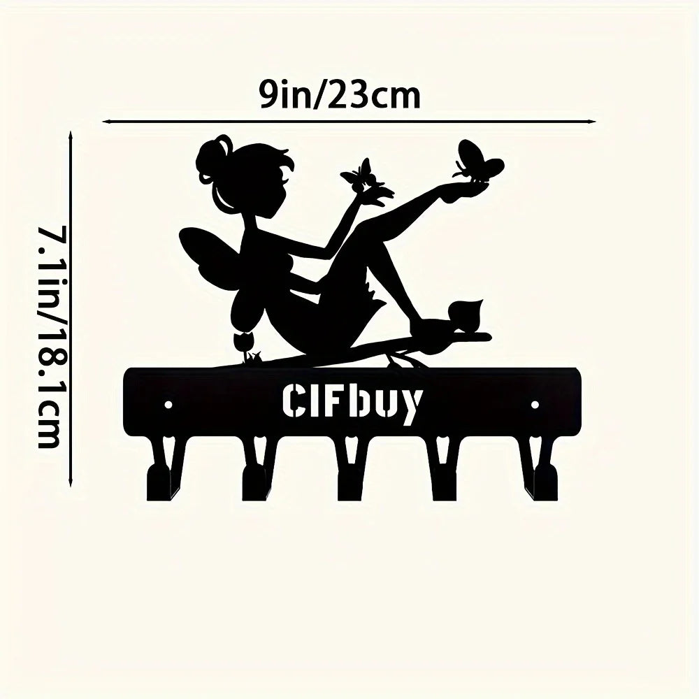 Black decorative metal key holder rack with hooks and a silhouette of a woman holding a butterfly