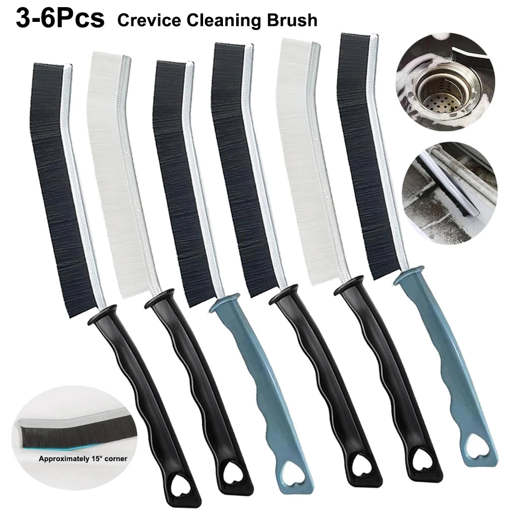 A set of six black and white crevice cleaning brushes with grips for tight spaces