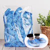 A clear plastic bag filled with blue reusable transparent shower caps.