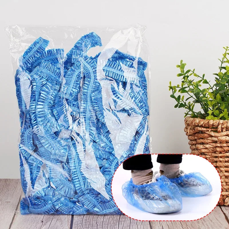 A clear plastic bag filled with blue reusable transparent shower caps.