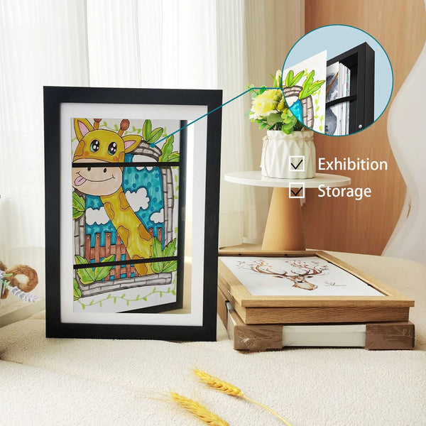 A black framed art print featuring a cartoon giraffe in a wooden frame, shown alongside options for exhibition and storage.
