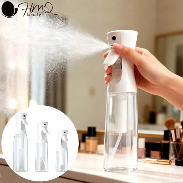 A hand sprays a fine mist from a white glass bottle, demonstrating refillable continuous spray bottles for skin and salon use