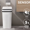 A white automatic motion sensor bathroom trash can next to a toilet, highlighting its features like mute, kick & touch sensor