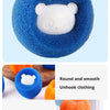 A hand is squeezing a blue laundry ball, demonstrating the cleaning power of reusable pet hair catcher laundry balls.