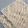 A set of natural beige cotton mesh soap saver pouches.