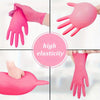 Varias angulaciones muestran guantes desechables de nitrilo rosados, demostrando alta elasticidad y flexibilidad.