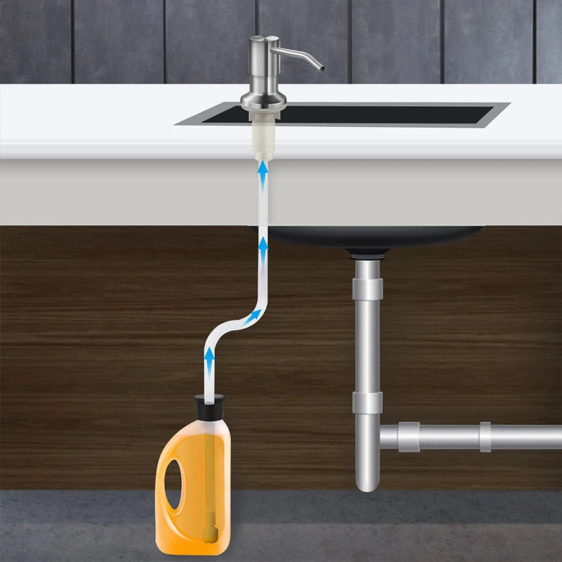 Stainless steel under-sink soap dispenser kit with an extension tube mounted above a kitchen sink.