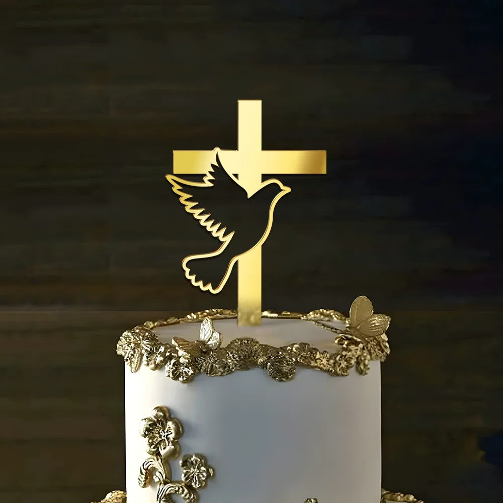 Gold acrylic cross and dove cake toppers on a white cake.