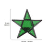 A green forged iron star hanging candlestick with a dark finish.