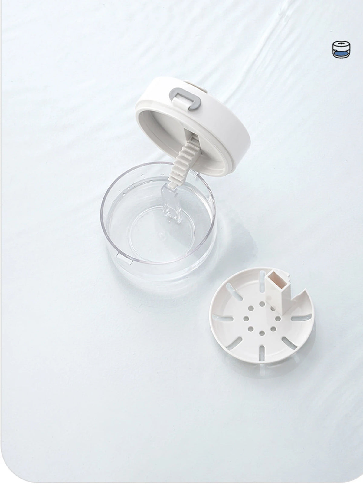 A white portable multi-tool organizer for dental appliances is shown on a white surface.