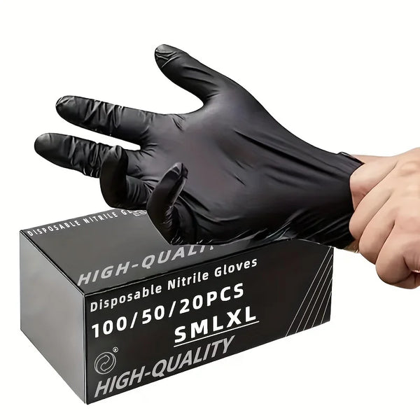 A hand wearing a black disposable nitrile glove is holding a box of high-quality disposable nitrile gloves.