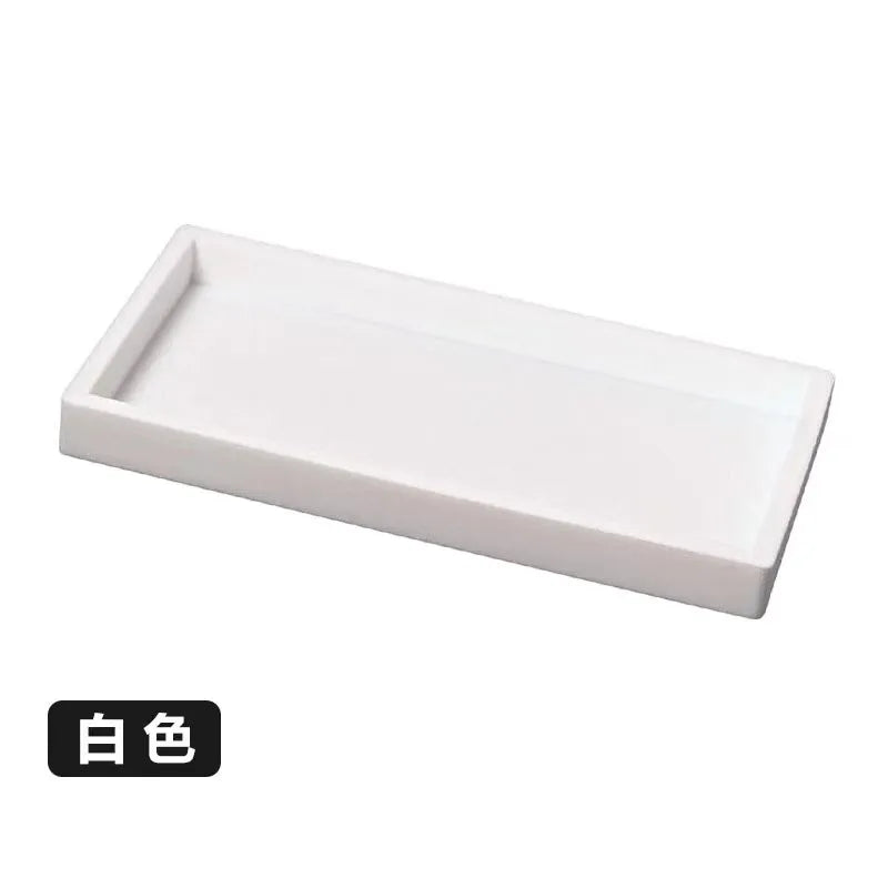White silicone kitchen and bathroom tray organizer set.