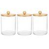 Three clear glass apothecary jars with wooden lids and cork stoppers for storage organization