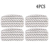 Four replacement microfiber pads with a gray and white chevron pattern for a Shark steam mop.