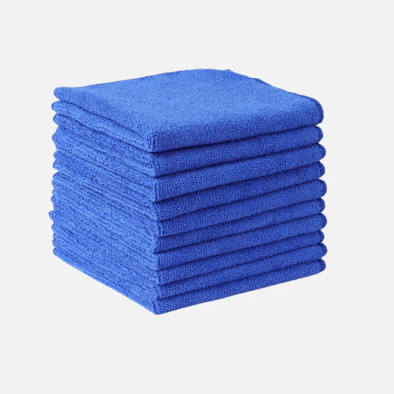 A stack of bright blue thickened microfiber cleaning cloths.