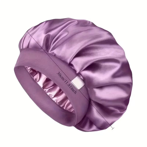 A purple satin hair bonnet shown from above, highlighting the fabric texture and measurement markings.