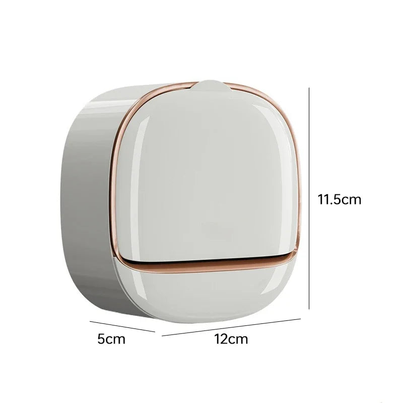 A round, wall-mounted soap dish with a lid and drainage, shown in a light gray color.