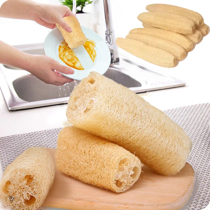 A stack of natural loofah exfoliating body sponges with hanging rope shown on a wooden board.