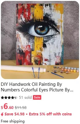 A painting of an eye created using numbers and colors on canvas with paint tubes and brushes nearby.
