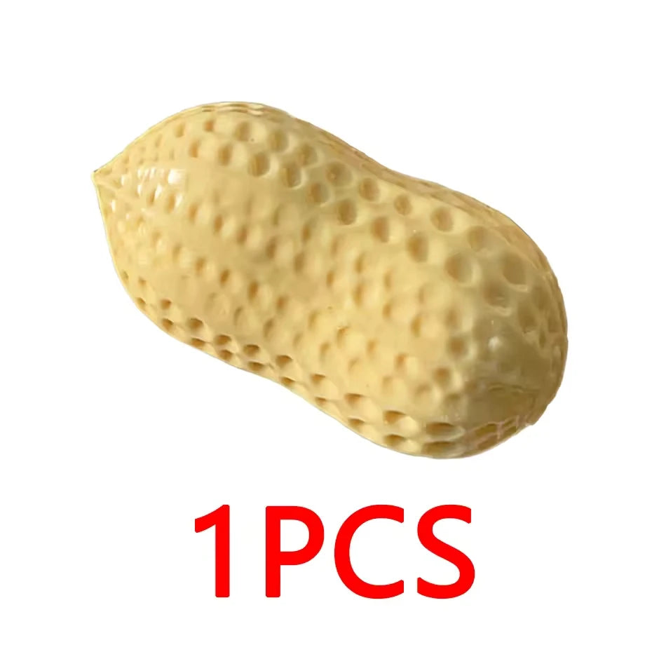 A single yellow squishy stress relief toy shaped like a peanut.