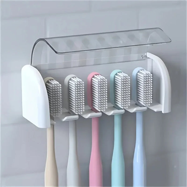 A clear acrylic storage rack holding several toothbrushes in various pastel colors.